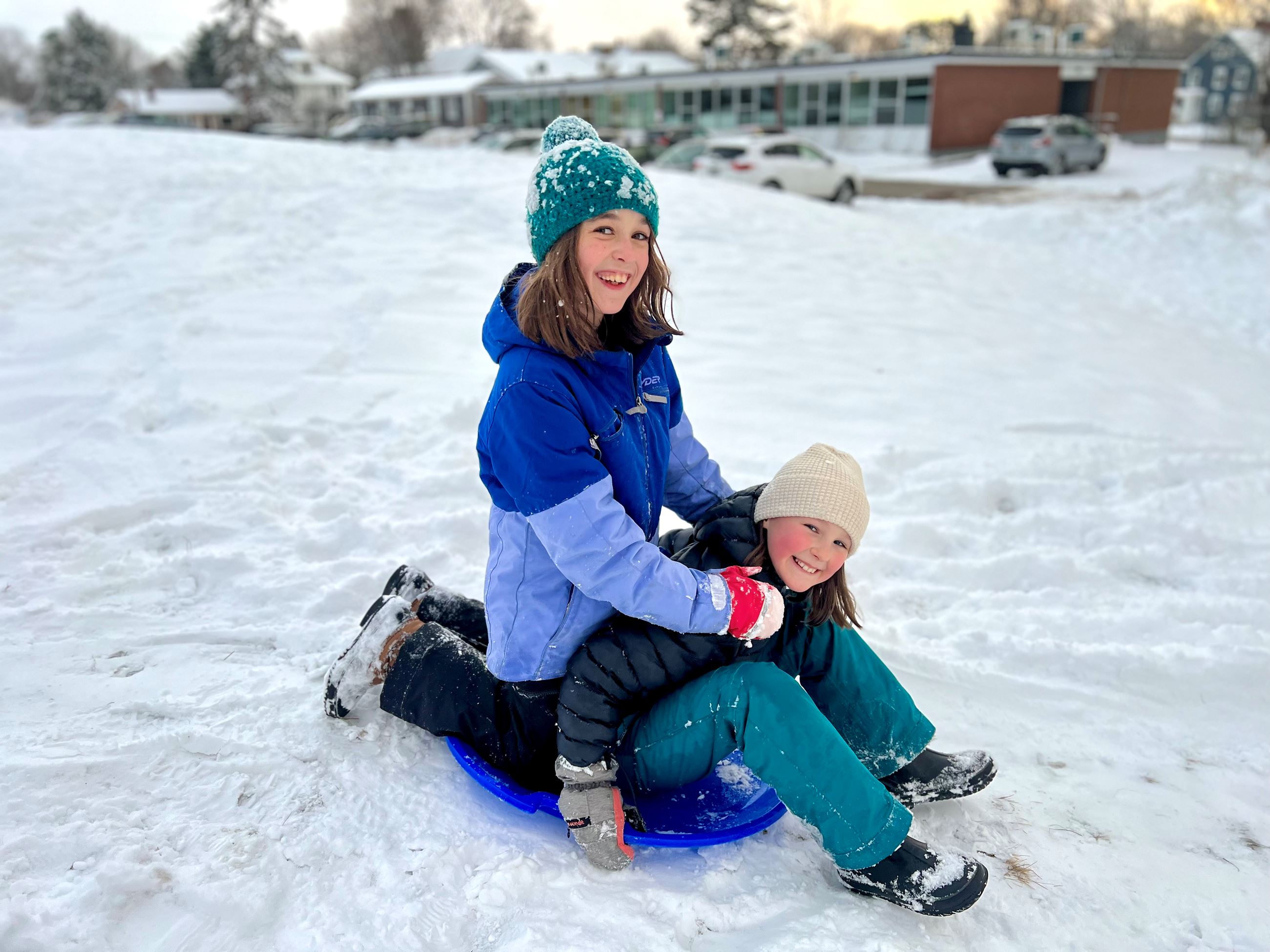 Children on sled in snow